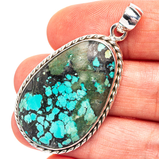 Oval turquoise stone pendant in .925 sterling silver bezel with top bail