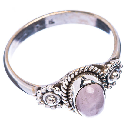 Sterling silver dainty ring with oval rose quartz stone, braided bezel, and bead details