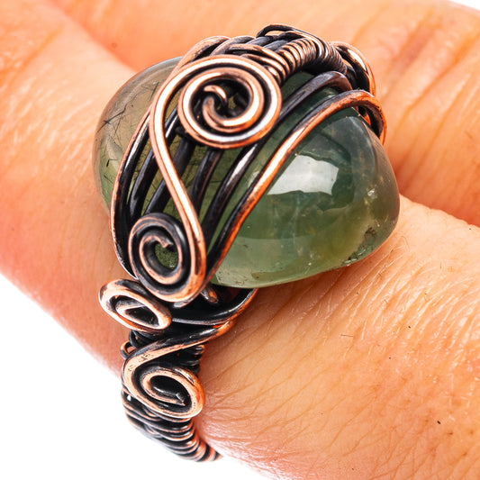 Oxidized copper wire wrap ring with oval green prehnite gemstone, swirl detailing