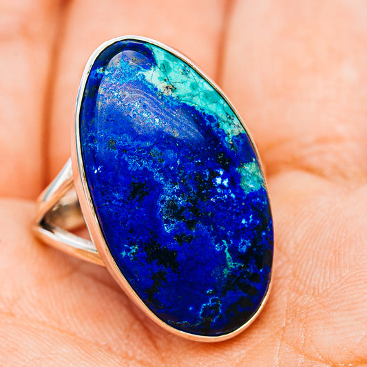 Bezel-set oval sterling silver ring with dark blue azurite gemstone, side view