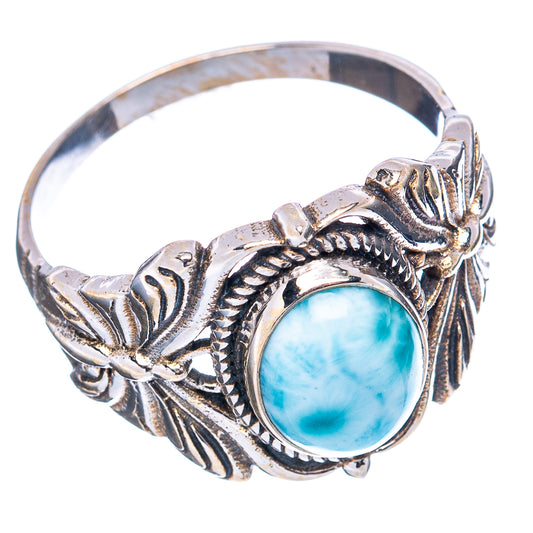 Silver butterfly ring with oval light-blue cabochon and detailed leaf metalwork