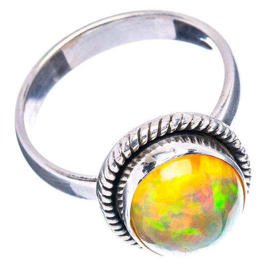Sterling silver opal ring with oval rainbow opal bezel and rope design on band