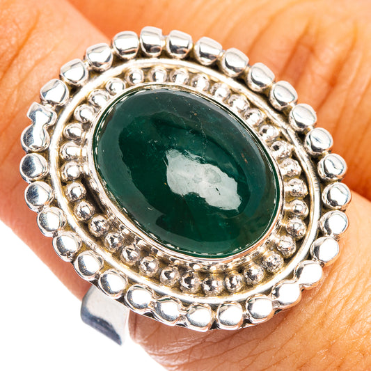 Oval green emerald cabochon sterling silver ring with beaded halo and adjustable band
