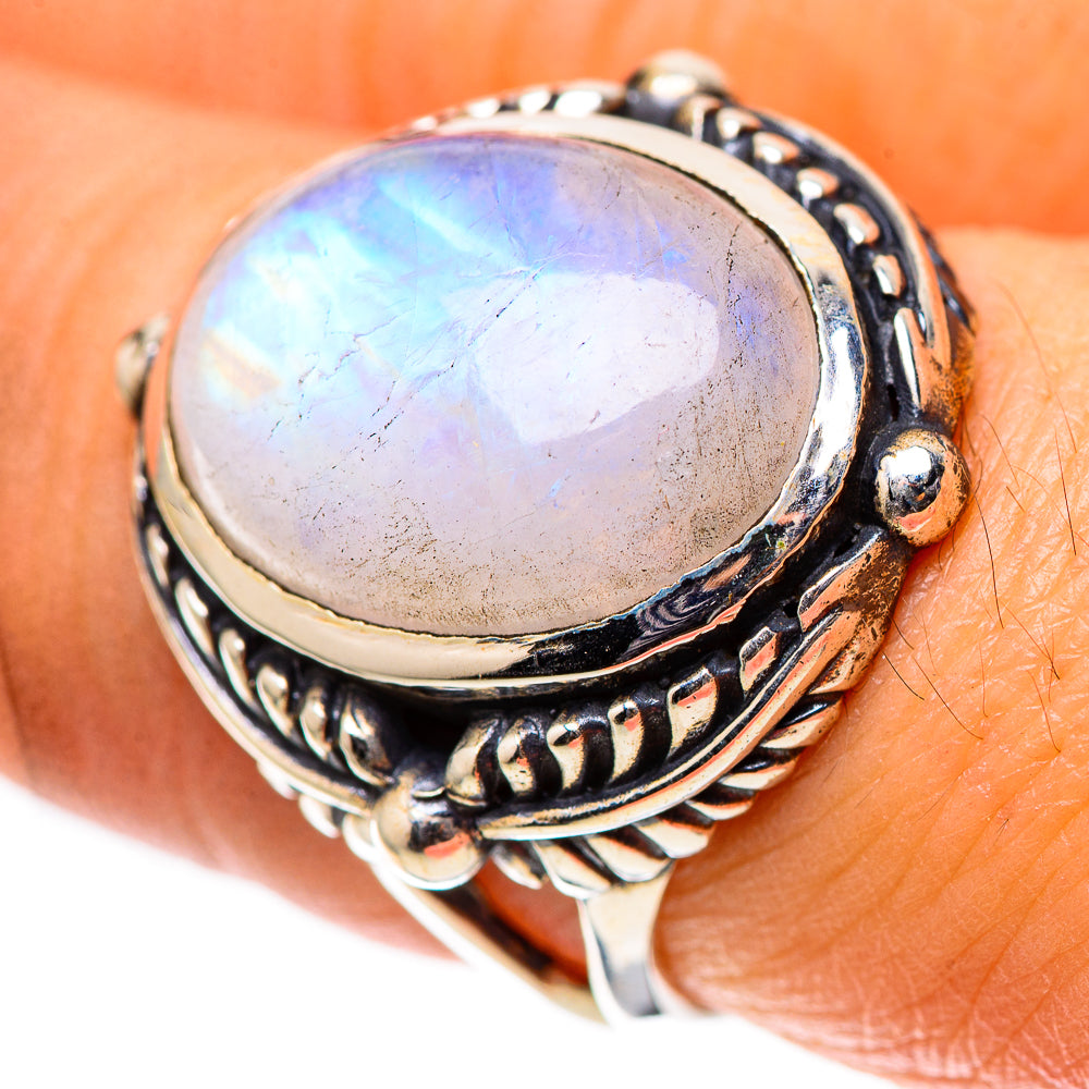 Sterling silver moonstone ring with oval iridescent cabochon and ornate band