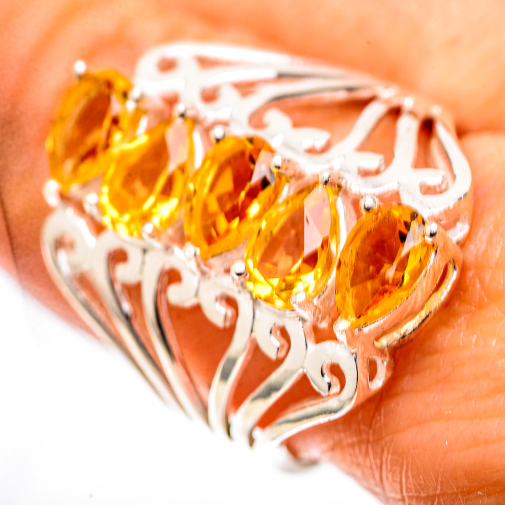 Sterling silver ring with three faceted yellow stones and filigree openwork design