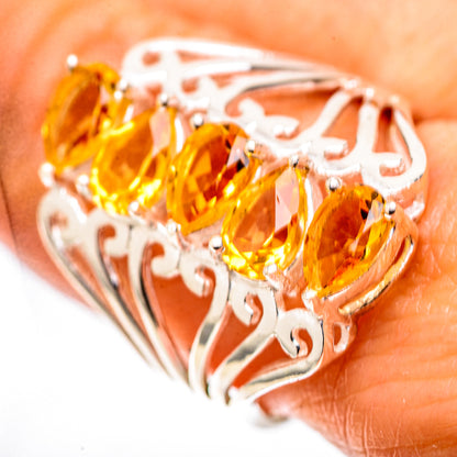 Sterling silver ring with three faceted yellow stones and filigree openwork design