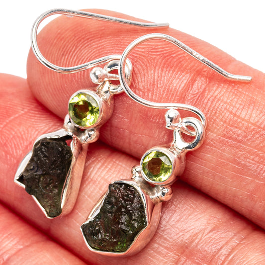 Sterling silver earrings with peridot-green round stones and rough dark green moldavite dangles