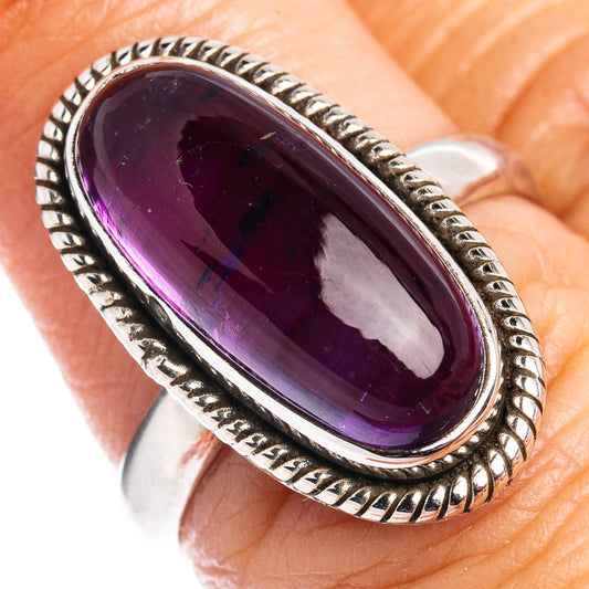 Oval amethyst sterling silver ring with rope-style bezel, dark purple gemstone