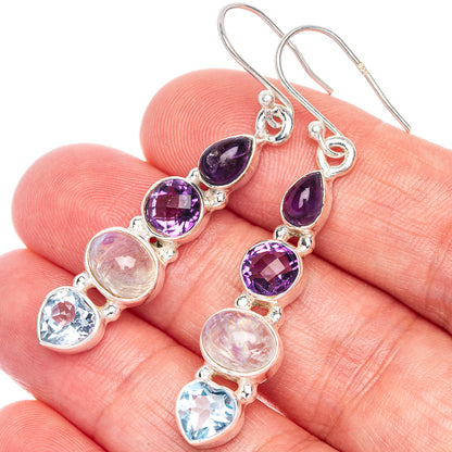 Close-up sterling silver gemstone drop earrings: amethyst, moonstone, and blue topaz