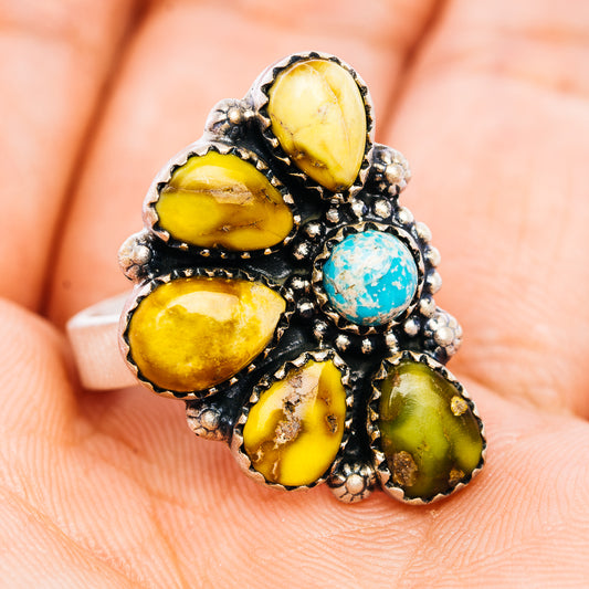Adjustable turquoise and yellow oval gemstone ring, black setting with silver accents