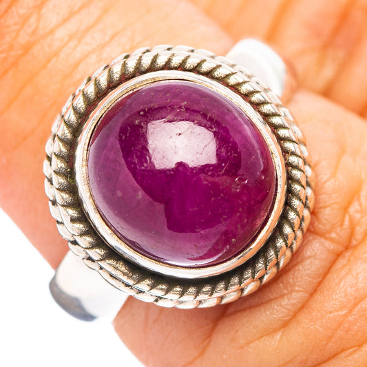Sterling silver ruby ring with oval purple cabochon and rope-style bezel