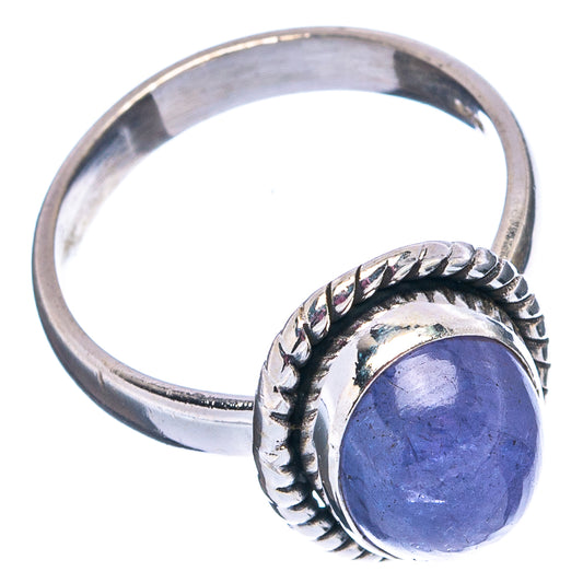 Sterling silver tanzanite ring with oval purple stone and carved band, side view