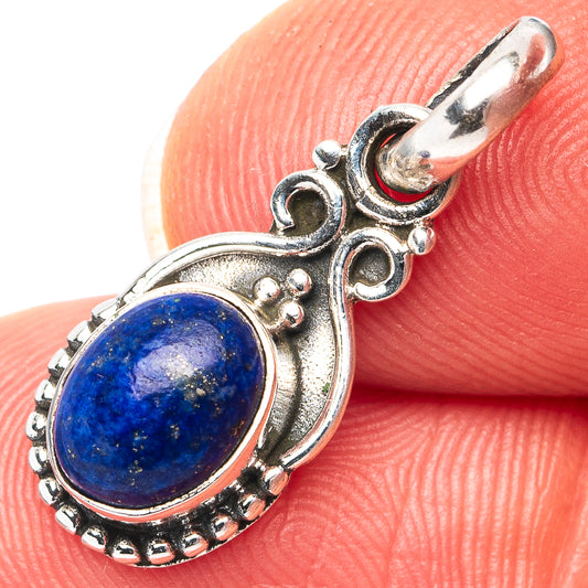 Sterling silver lapis lazuli oval pendant with ornate frame and small bead details