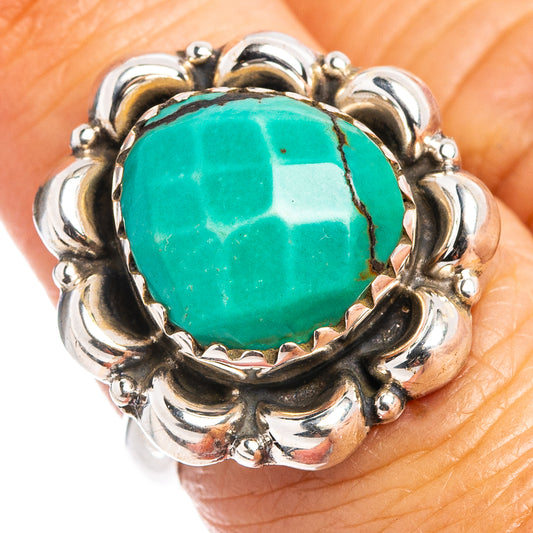 Sterling silver turquoise ring with close-up round teal cabochon and detailed prong setting