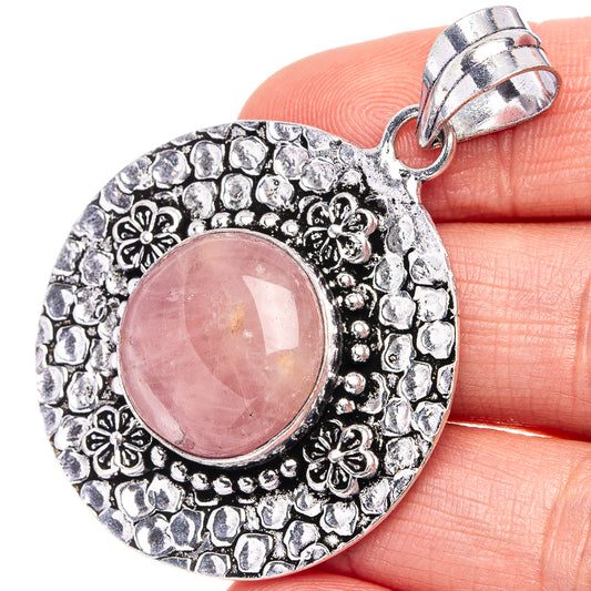 Rose quartz pendant, round pink cabochon in ornate German silver setting