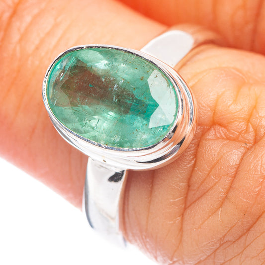 Zambian emerald oval ring in .925 sterling silver with faceted green gemstone, close-up