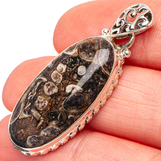 Turritella agate pendant in .925 sterling silver oval setting with ornate bail