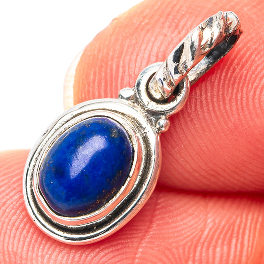 Sterling silver lapis lazuli oval pendant with raised bezel and top bail detail