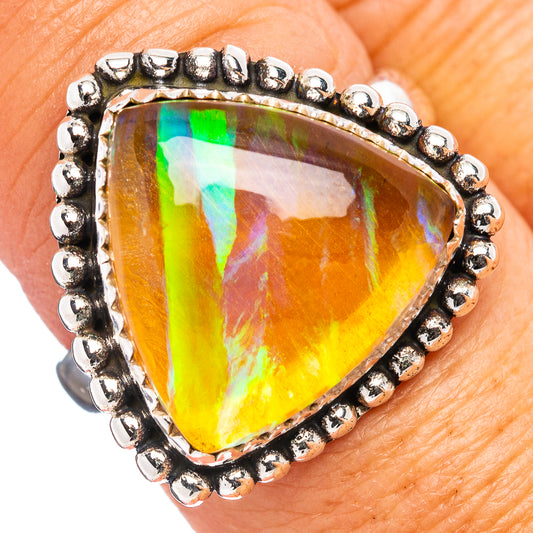 Ethiopian opal ring, pear-cut opal with rainbow flashes, .925 sterling silver beaded bezel
