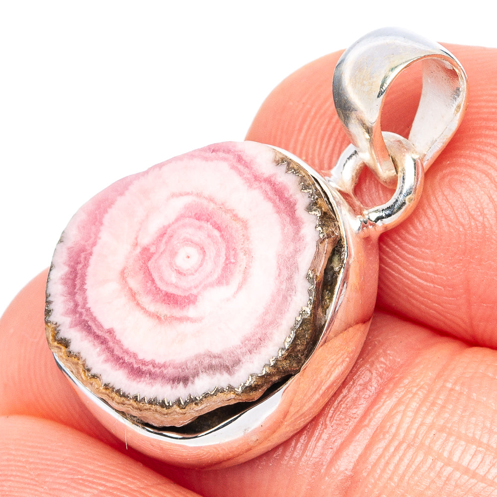 Sterling silver pendant with pink rhodochrosite rosette-like slice in bezel setting