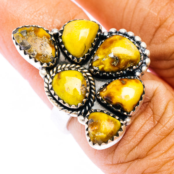 Sterling silver adjustable ring with five yellow teardrop stones in rope settings