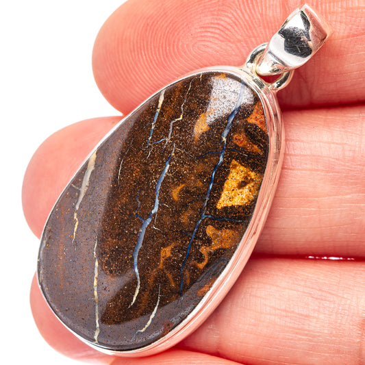 Oval boulder opal pendant in .925 sterling silver bezel, dark brown with blue and gold streaks.