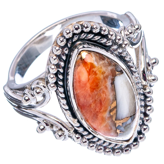 Spiny oyster ring with oval cabochon and detailed silver scrollwork, beaded frame
