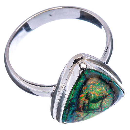 Sterling silver opal ring, side view of triangular bezel with green-orange iridescence.