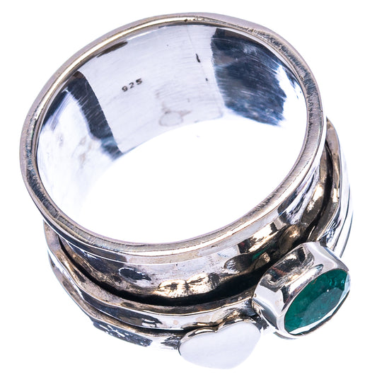 Sterling silver ring showing inside band and green emerald side stone