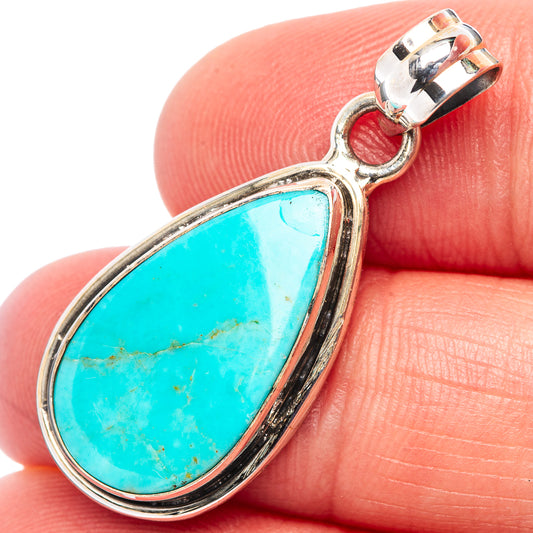 Sterling silver turquoise teardrop pendant with raised bezel and loop bail