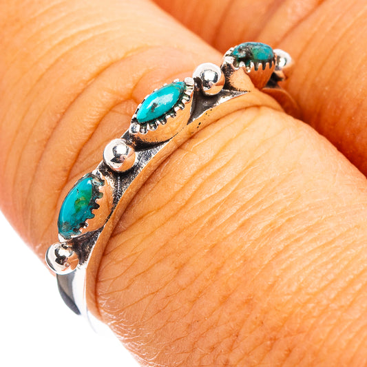Turquoise and sterling silver ring with oval stone accents