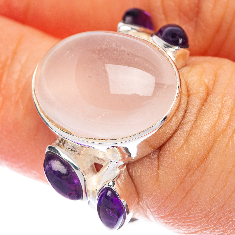 Sterling silver oval rose quartz ring with purple amethyst accents on the band