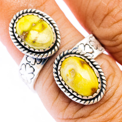 Sterling silver oval gemstone ring with yellow stone and twisted bezel