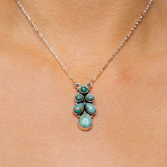 Turquoise pendant necklace with 925 sterling silver chain and teardrop stone cluster