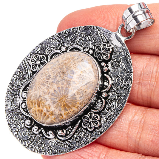 German silver coral pendant with oval resin stone and floral filigree bail