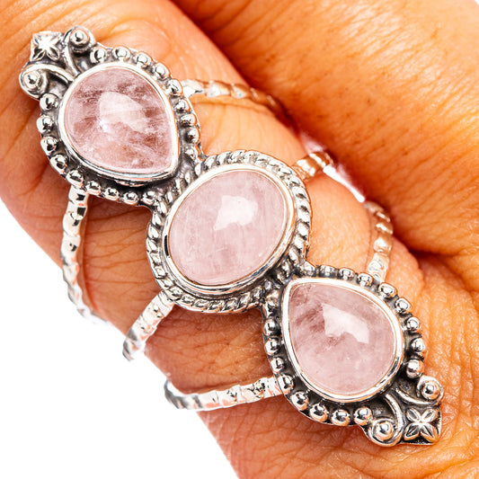 Sterling silver morganite ring featuring three oval pink stones with beaded trim