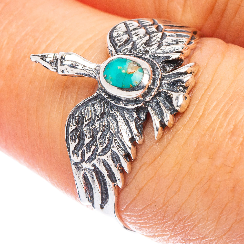 Silver phoenix ring with oval turquoise stone, ornate feather details