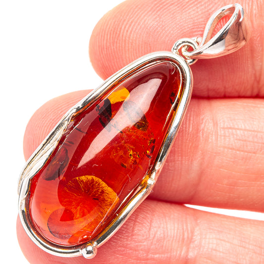 Red and yellow Baltic Amber leaf pendant in .925 sterling silver bezel