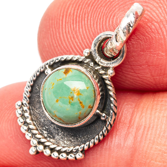 Turquoise teardrop pendant in .925 sterling silver with round cabochon stone and bail