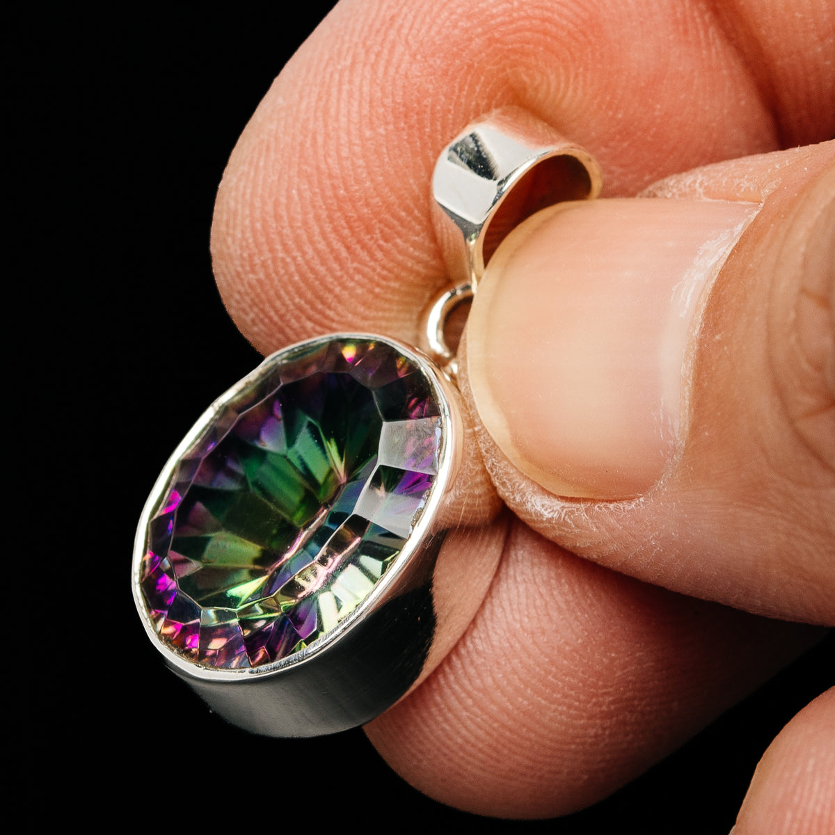 Rainbow mystic topaz oval pendant in .925 sterling silver bezel, side view