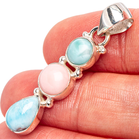 Triple oval pink and blue opal-style sterling silver pendant close-up on stone