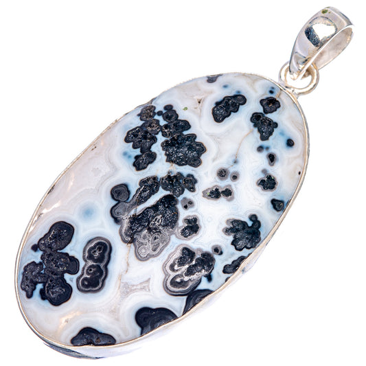 Teardrop agate pendant, white with blue-tinted patches and black mineral inclusions, silver bail