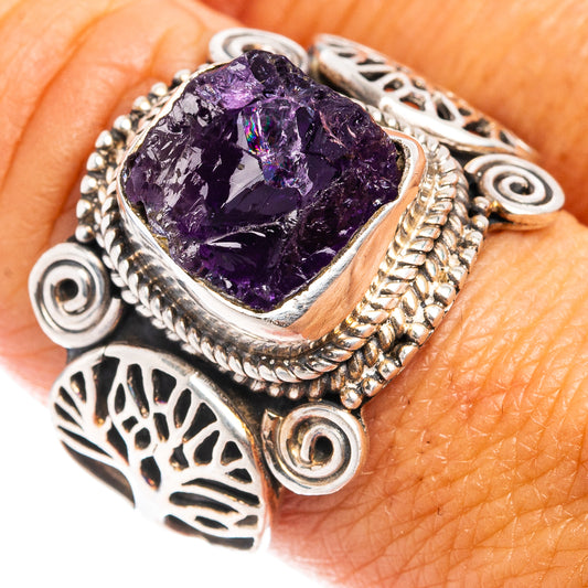 Amethyst gemstone sterling silver ring with ornate silverwork and dark purple stone