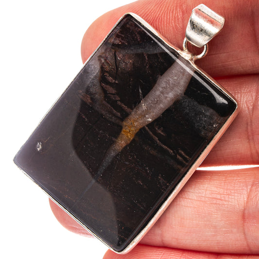 Black banded agate pendant, rectangular with silver bail and glossy stone surface.