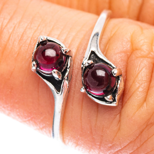 Dainty garnet ring in .925 sterling silver with an oval red gemstone, size 7