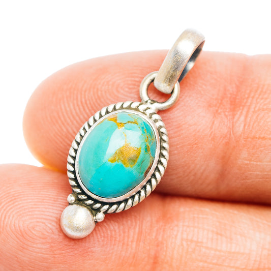 Turquoise oval sterling silver pendant with rope border and small bail loop