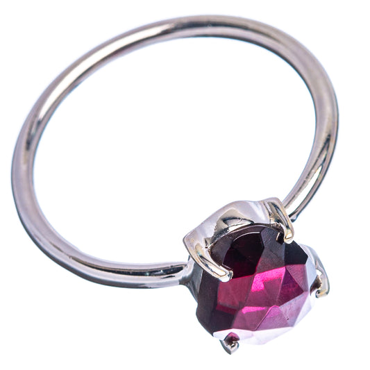 Sterling silver ring with faceted dark garnet oval stone in bezel prongs