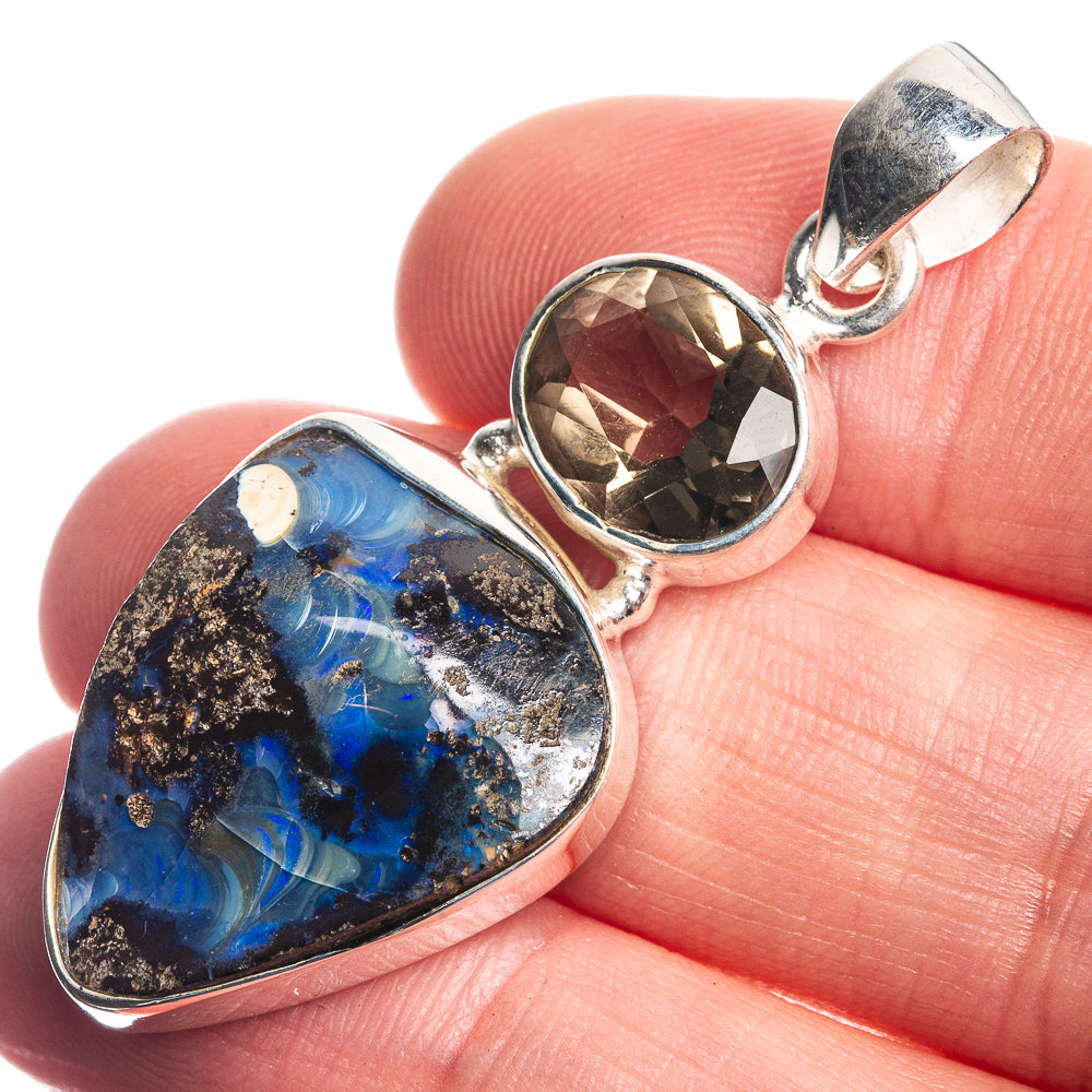 Sterling silver pendant with blue-and-black boulder opal and round smoky gemstone