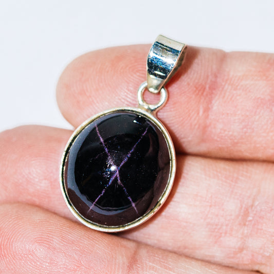 Round star garnet pendant with dark cabochon and .925 sterling silver bezel bail