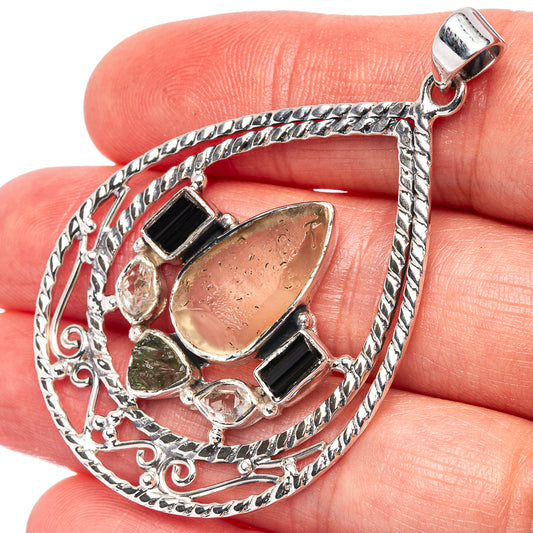 Sterling silver teardrop pendant with black square stones and green irregular stone